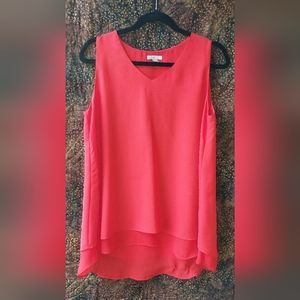 Tunic length tank top.  Medium. Fits a bit snug across chest and arm holes.